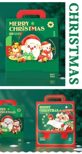 Close-up of festive Christmas paper gift bag with cute cartoon Santa and reindeer prints