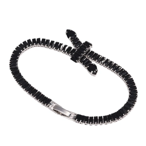 Silver-toned tennis bracelet with black rectangular zircons and a cross charm design