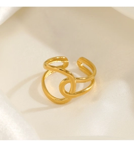 Detail of 18K gold plated wavy crisscross open ring on elegant white silk background