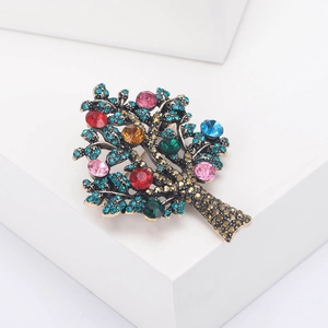 Detailed view of Tree of Life brooch with multicolor rhinestones on bronze base