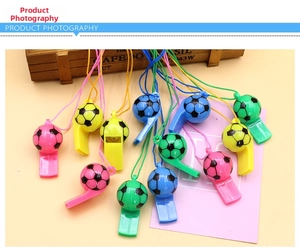 Close-up of colorful football whistles with matching lanyards for sports events