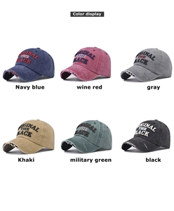 Detailed view of six vintage washed baseball caps with embroidered logo and distressed brims