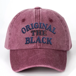 Close-up of the vintage burgundy washed cotton cap featuring original 3D embroidery detail