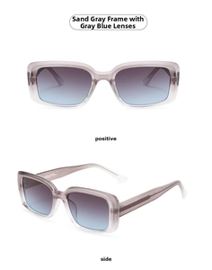 Detail view of square sand gray matte sunglasses with blue gradient lenses