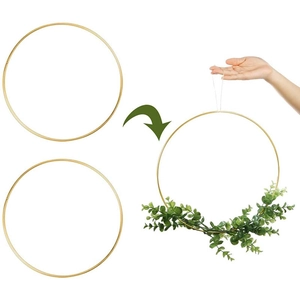 Golden metal floral hoops set with green eucalyptus leaves for DIY wreath crafts