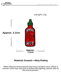 Macro detail of cartoon chili sauce enamel pin showing 3.3cm size and hot sauce design