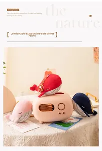 Macro detail of soft plush whale charms in blue, red and pink with golden keychains