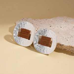 Retro geometric silver hoop earrings with brown plush leather wrap and hammered metal