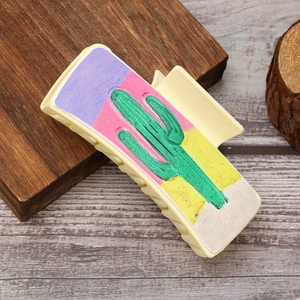 Rectangle hair claw clip with western cactus print and colorful patchwork pattern