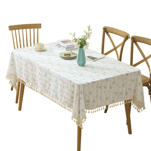 Floral cotton linen tablecloth with daisy print and elegant fringe edges for dining decor