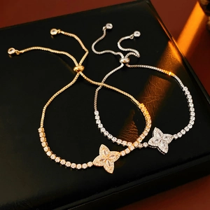 Detail of adjustable flower bracelet with sparkling cubic zirconia on black leather