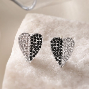 Elegant heart stud earrings with black and white cubic zirconia in silver setting