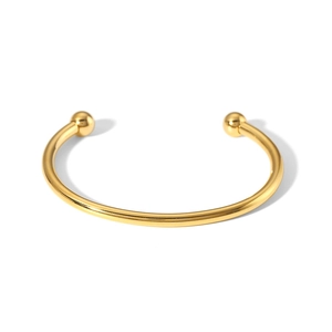 Detail of 18K gold plated stainless steel open bangle with spherical bead ends