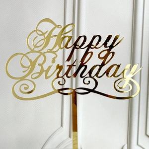 Golden acrylic Happy Birthday cake topper with elegant calligraphy for party decor
