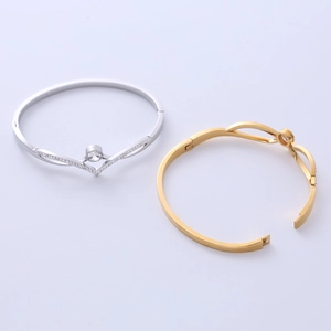 Elegant V-shaped titanium steel bracelet with center crystal and hidden clasp closure