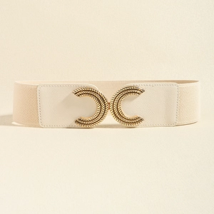 Detail of beige elastic waist belt featuring a gold vintage intertwined metal buckle
