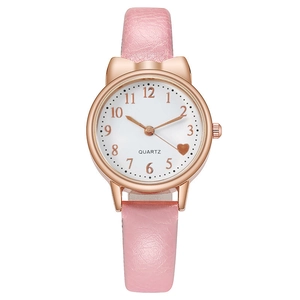 Detail of rose gold cat-ear watch with pink leather strap and white dial