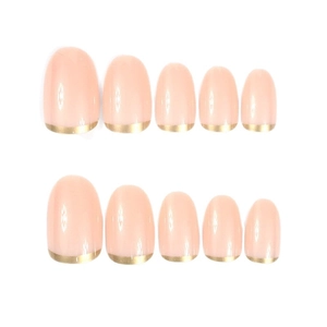 Short oval press-on nails with nude pink base and golden metallic French tip design