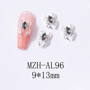 Detail of 9x13mm silver spider nail art charm with marquise grey gemstone on pink nail