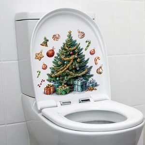 Detail view of waterproof Christmas tree PVC stickers applied on a white toilet lid