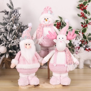 Pink telescopic Christmas figurines of Santa, snowman and reindeer on a wooden stand