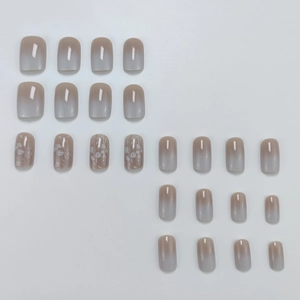 Elegant white gradient press-on nails with delicate floral art patterns and square tips