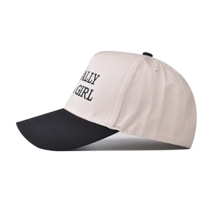 Detail view of cotton baseball cap with side embroidery and contrast stitching