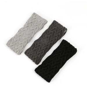 Detail showing grey and black knitted headbands with thick wool texture and bow design