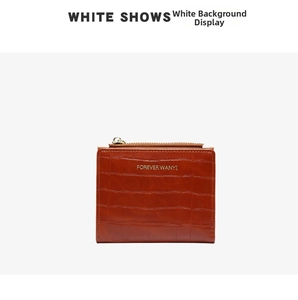 Detail of brown crocodile pattern small zipper wallet with textured faux leather finish