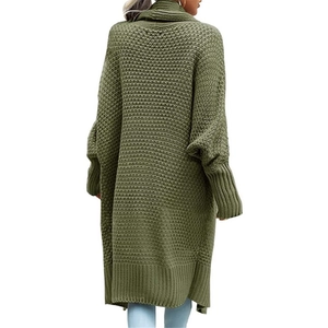 Back view of a long olive green knit cardigan with lantern sleeves in chunky knit texture