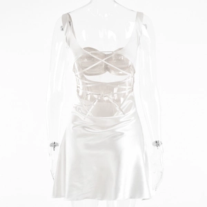 Close-up of white satin mini dress featuring a criss-cross backless tie design