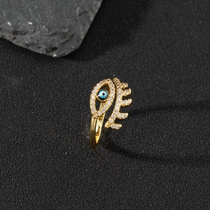 18K gold-plated Evil Eye open ring with sparkling cubic zirconia on a dark stone base