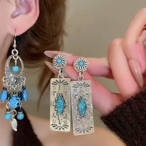 Ethnic turquoise drop earrings with silver leaf tassels and bohemian vintage sunburst engraving