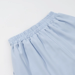 Detail of light blue high-elastic elastic waistband on casual shorts with soft texture