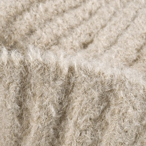 Thick warm winter knitted beanie in beige plush mohair texture with ribbed pattern design