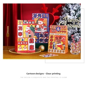 Close-up of three festive Christmas gift bags with Santa, snowman and deer patterns