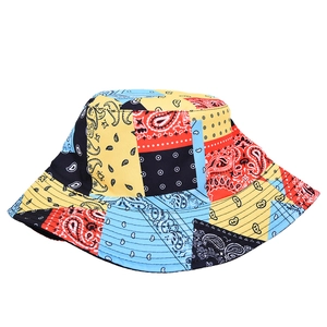 Close-up of multicolor paisley patchwork bucket hat with detailed stitching and cotton texture