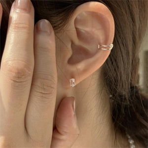Close-up of 925 silver square zircon stud earring and minimalist double-layer ear cuff