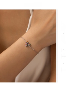 Detailed view of S925 silver bracelet featuring a colorful puzzle piece pendant with zircon