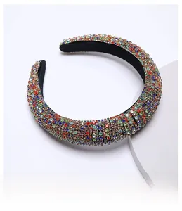 Close-up of luxury velvet headband featuring colorful rhinestones and soft inner lining