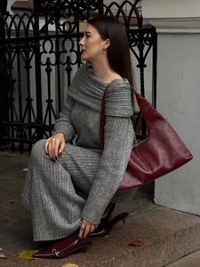 Detail of grey ribbed knit loungewear set paired with deep red leather shoulder bag