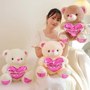 Three plush teddy bears in white, beige, and brown colors holding shiny pink LOVE hearts