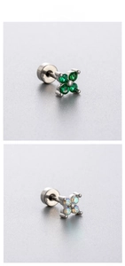 Detail of four-leaf clover stud earrings with green and opal gemstones in screw back design