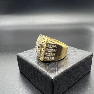 Close-up of a gold-plated square hip-hop ring set with sparkling zircons on jewelry box