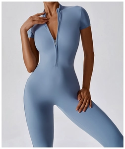 Detailed view of the front zipper and short sleeve cut on this light blue sports jumpsuit