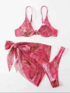 Detailed flat lay of pink marble bikini set with matching beach sarong wrap