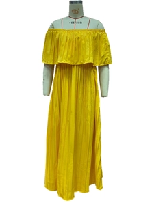 Detail of yellow pleated chiffon maxi dress showing off-shoulder neckline and ruffles