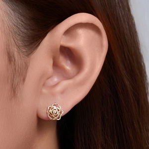 Elegant sterling silver gold-plated hollow rose earrings with a sparkling center diamond