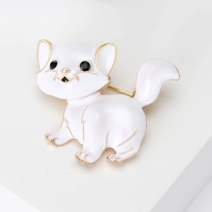 Vintage style white enamel cat brooch with gold edges and black gemstone eyes on white