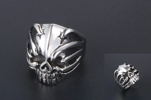 Macro detail of silver punk skull ring showing intricate gothic cast steel craftsmanship